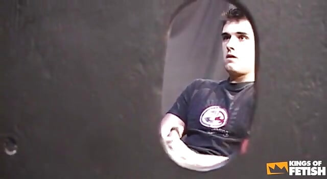 Young dude masturbates and cums in a guy's mouth through glory hole
