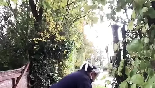 In a pink maid's outfit to go carry the trash can