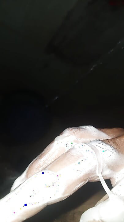 Guy in the shower soaps and masturbates by taking milk out of penis