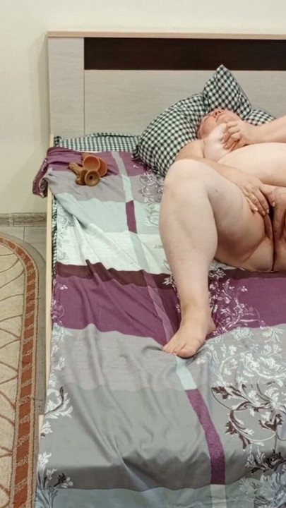 my mother-in-law masturbates her pussy with a black vibrator | Clip 1