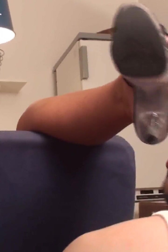 Richie kneels in the kitchen