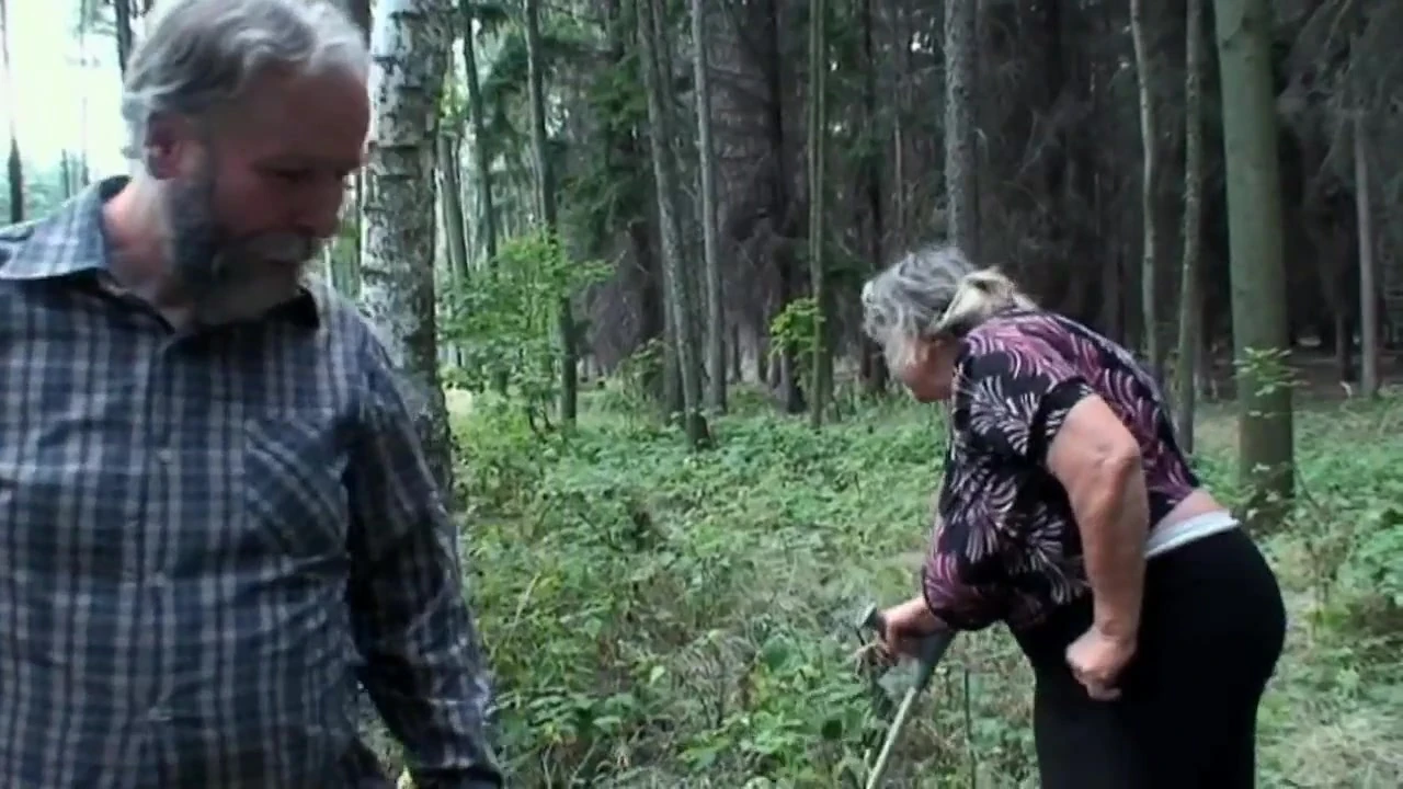 The girl looking for mushrooms sees an older lady with big