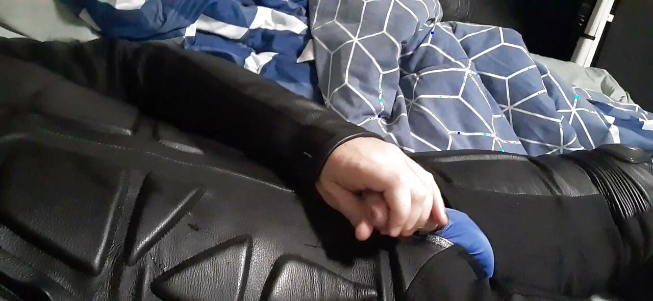Biker cums in leather moto race suit