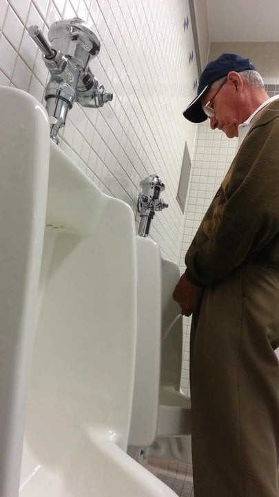 Older man getting relieving his bladder