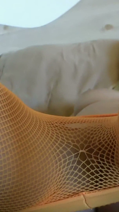 Blonde in Orange Fishnets - Glass Toy on the Purple Bed