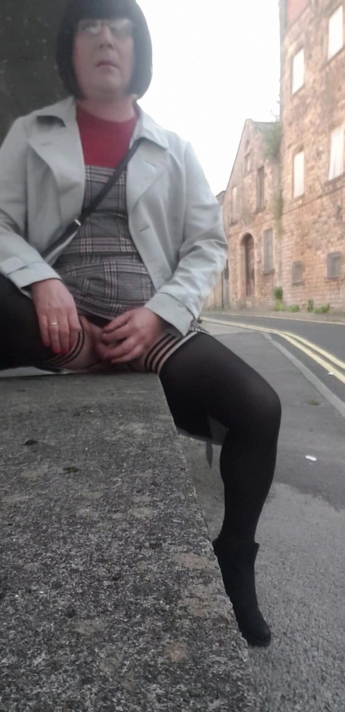 Crossdressing slut exposes her caged cock on public street | Clip 1
