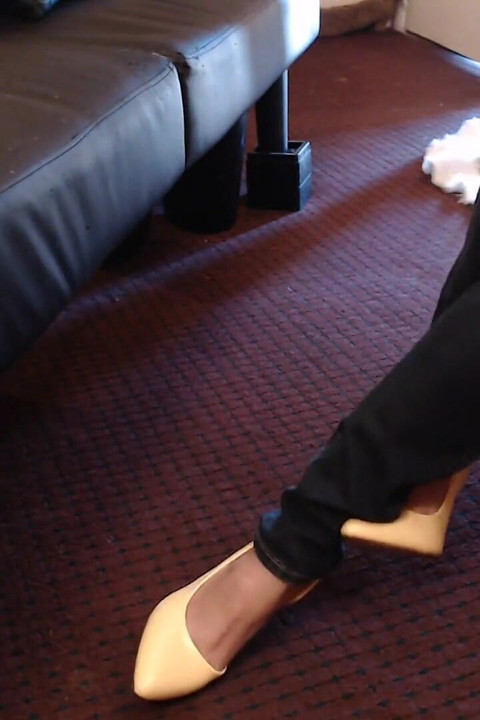 Double crossed yellow pumps dangling