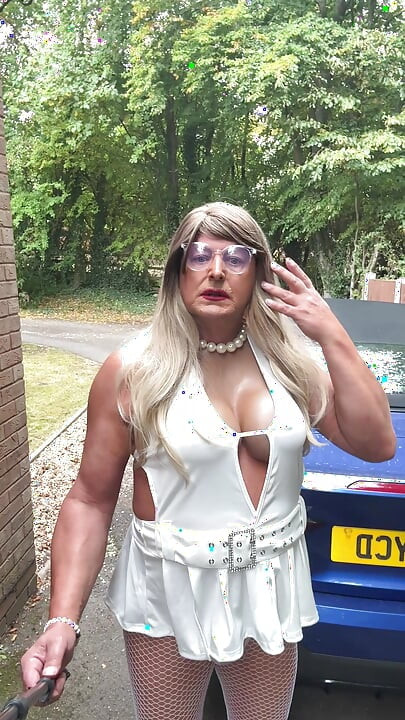 Sexy Crossdresser kellycd2022 in sexy white mini dress and fishnet pantyhose and heels