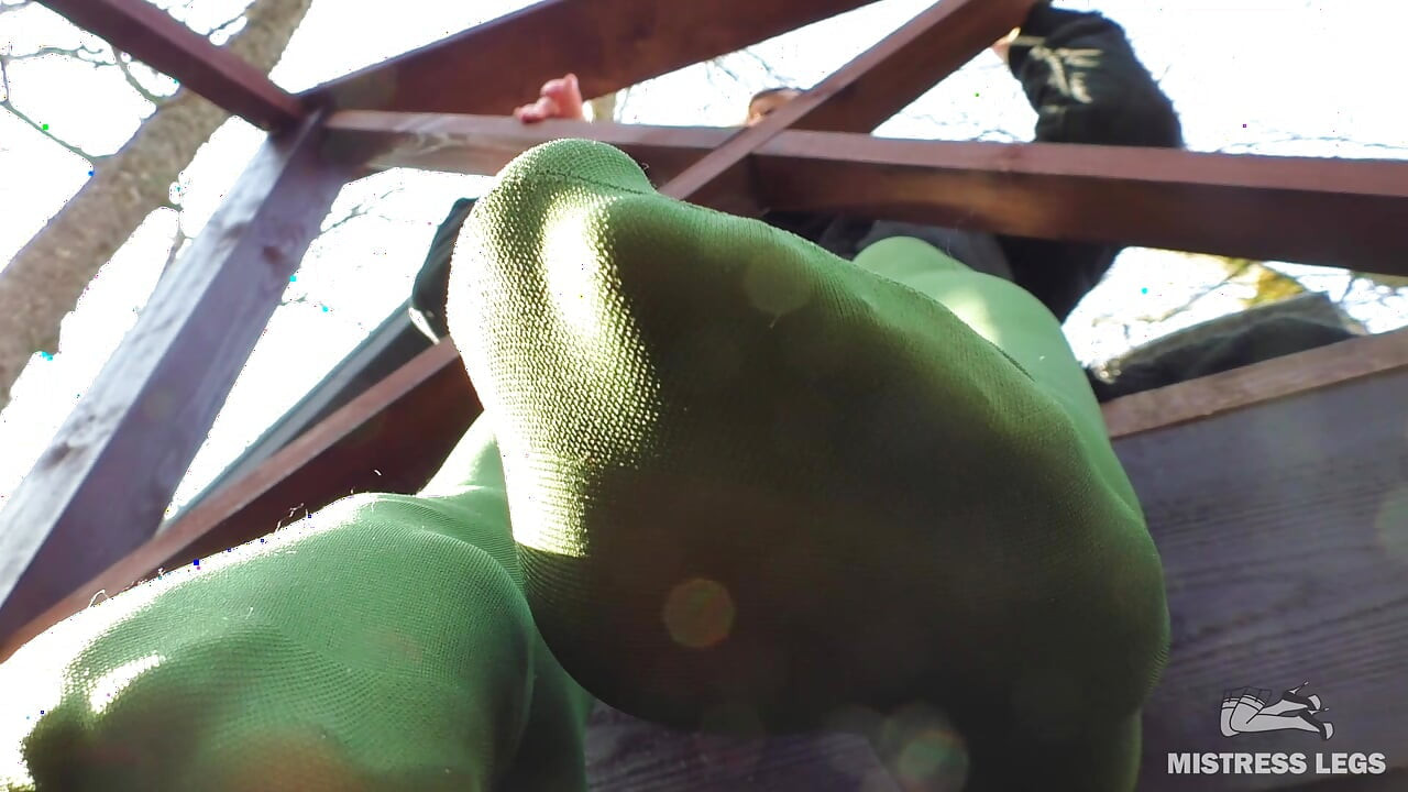 Goddess in Green Pantyhose Teases with Her Feet on the Porch