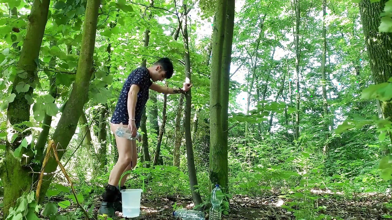 Balls Stretching Outdoor with Bucket Filled with Water and Jerk off