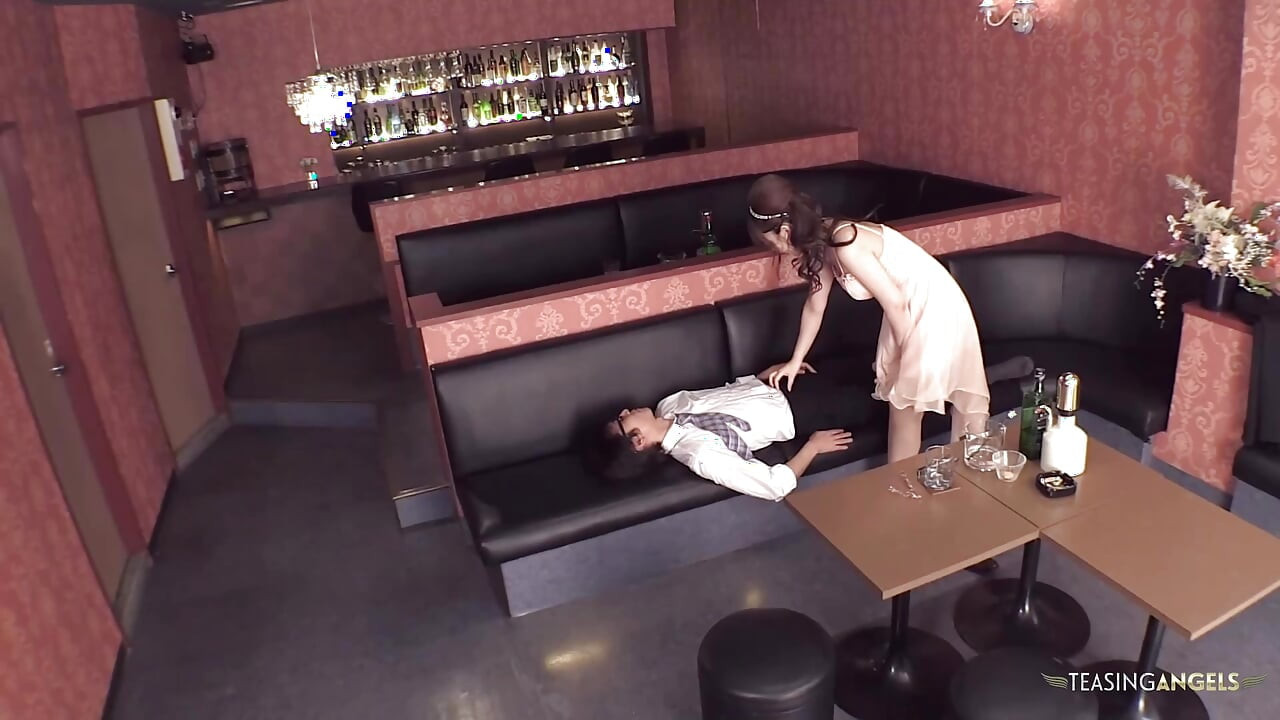 A sexually explicit scenario unfolds in which an Asian woman engages in oral sex with her partner in a restaurant, followed by a