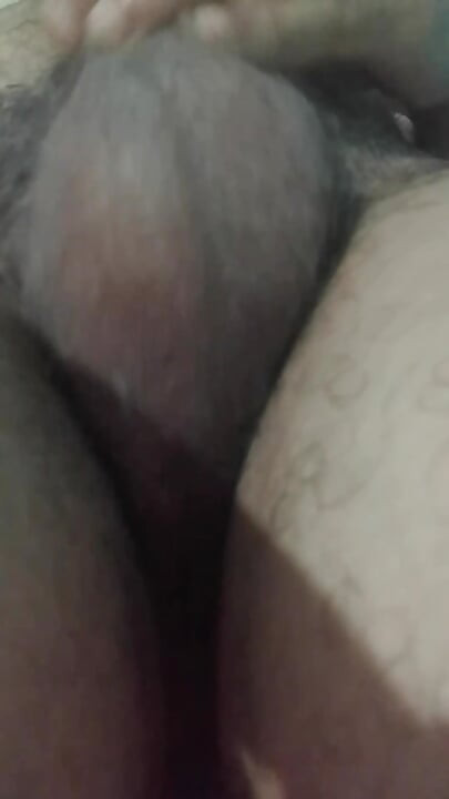 Masturbation, showing the testicles of the penis