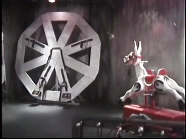 Sultry redhead dominatrix restrains and punishes pale white man in BDSM chamber