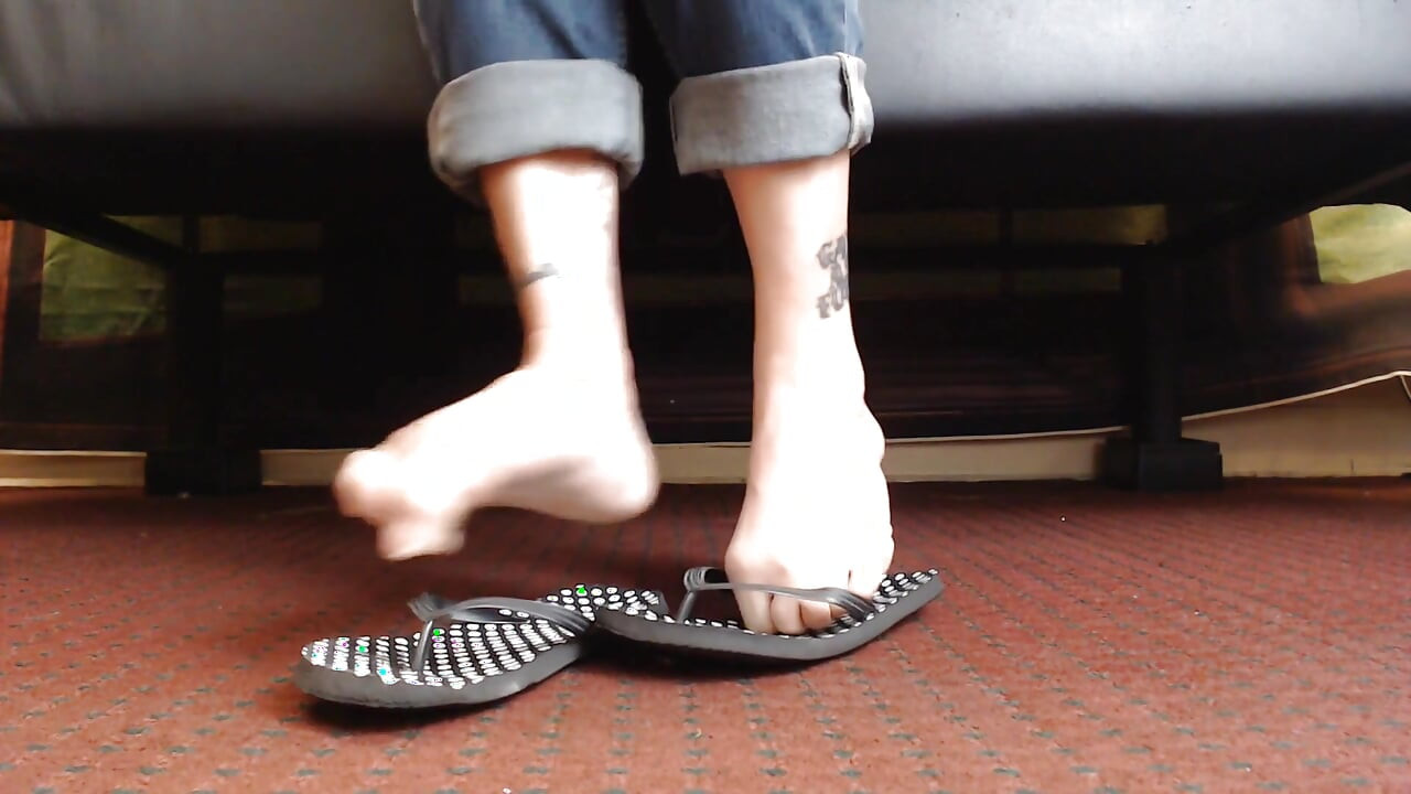 Dotted flipflop shoe play closeup
