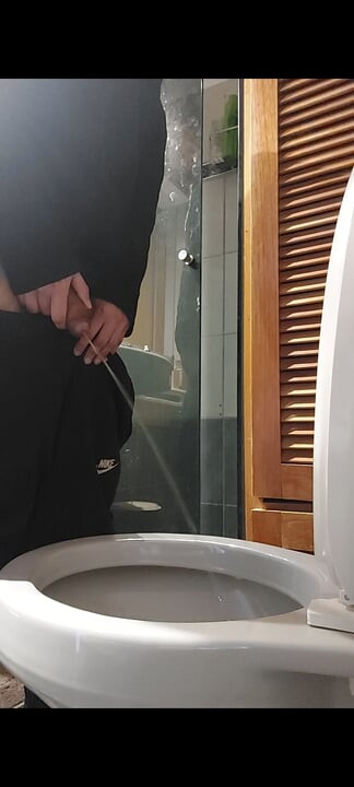 Peeing with a hard cock