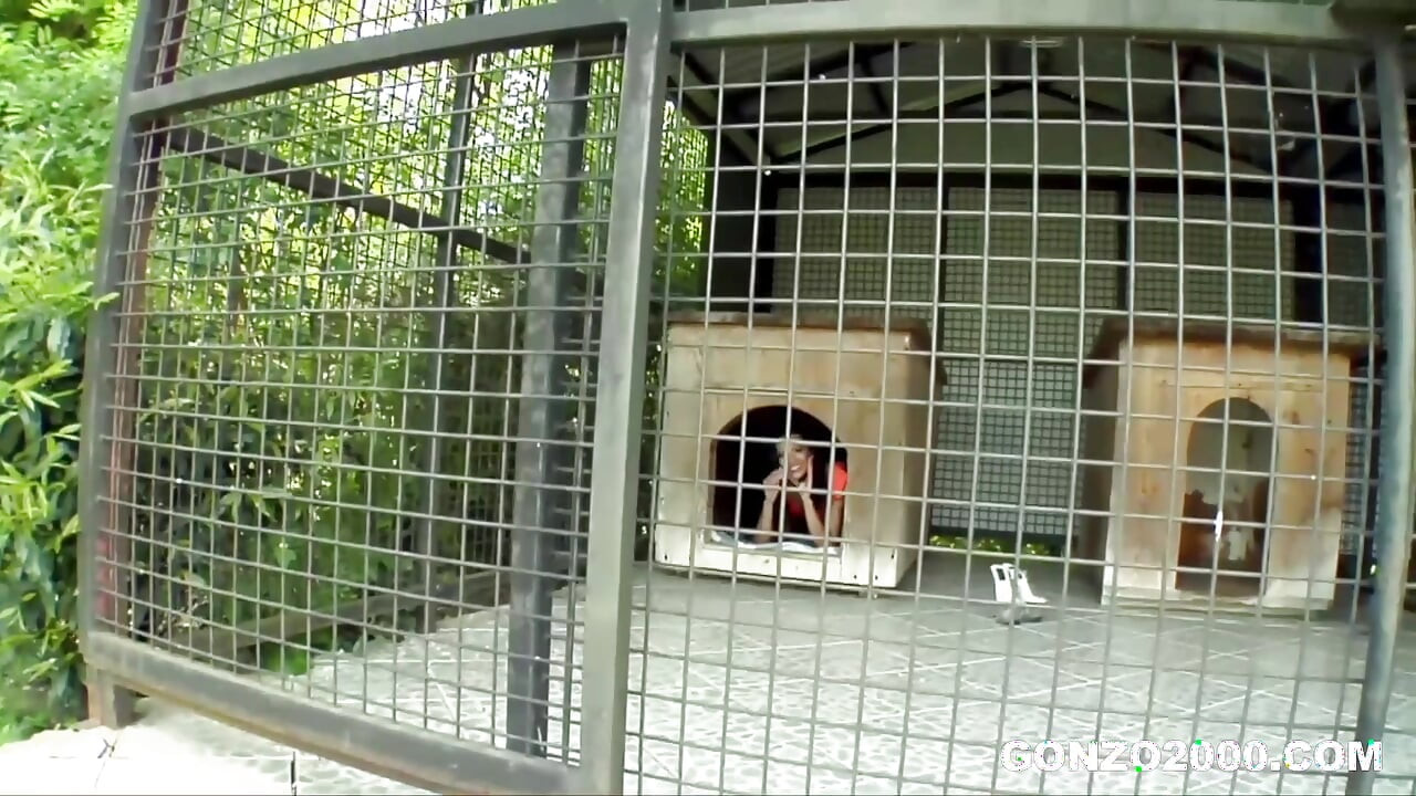 Mugur Mows the Lawn in Maid Outfit while Shalina is Locked in a Cage at Gonzo2000