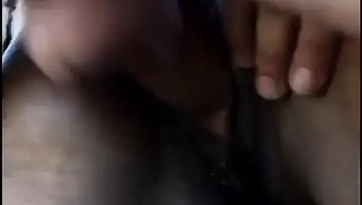 The striptease black girl is on her knees sucking on a dick