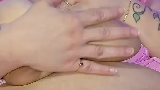 Naughty Bunny plays with her big tits