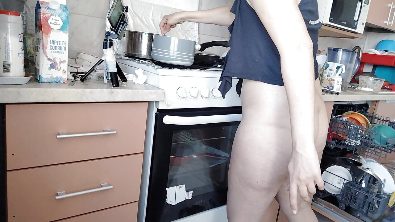 Sexy mom makes breakfast, hairy pussy, big tits. Sexy woman clears out the house, hairy, big ass.