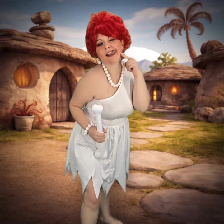cozy cave vibes, big hair, and a smile that might make the whole prehistoric neighborhood stop and stare.