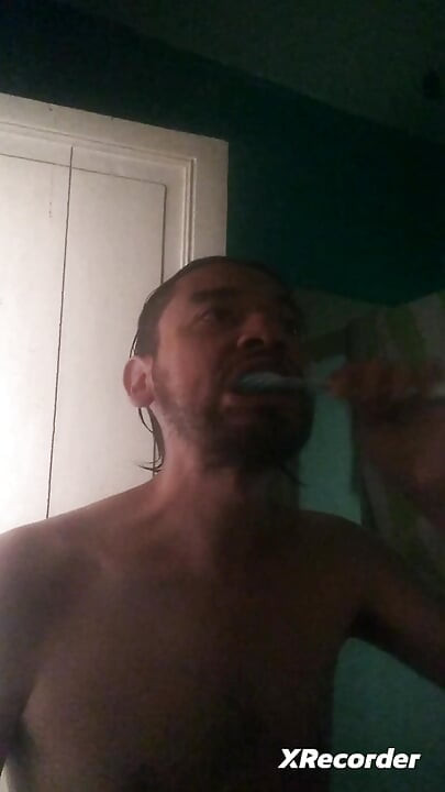 Man does his skincare in the morning