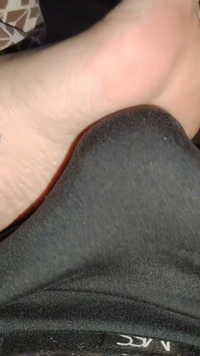 Stepsister's feet get a light massage while watching a movie | Clip 1