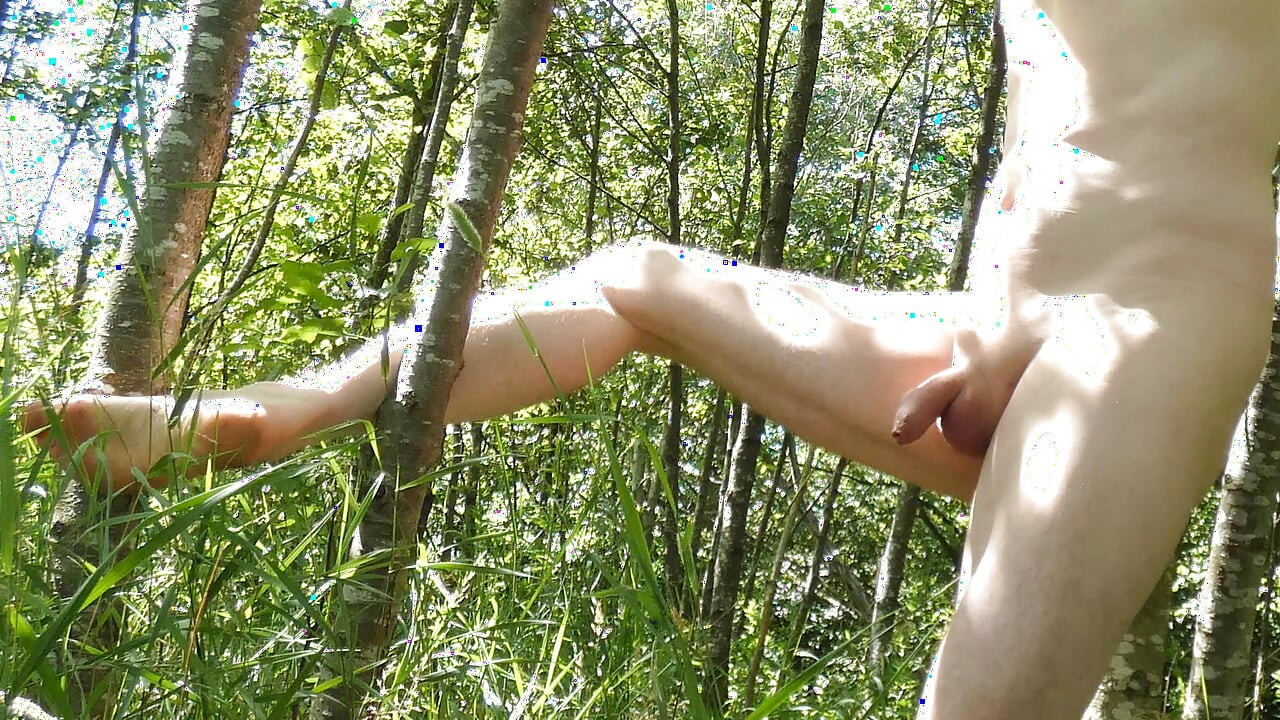 Man outside strips naked showing his small shrivelled little uncut penis and shaved body as he climbs trees in public woods