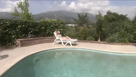Brunette slut with fake tits pussy toying in the swimming pool