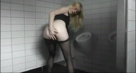 Anna Teasing Strangers in Public Men's Room
