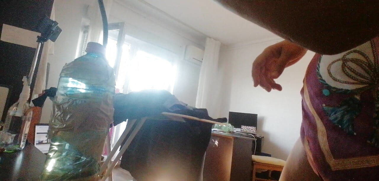 Amateur wife doing housework naked. Sexy and naughty wife trying on clothes that she cuts.