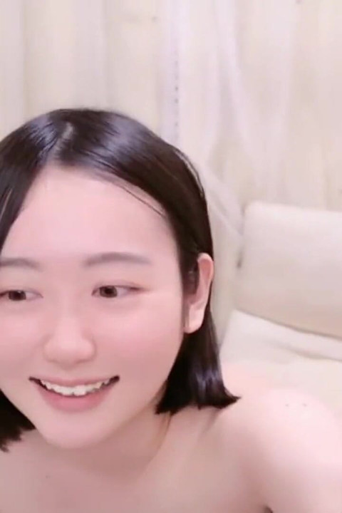 Pale Cute Woman with Natural Charm, Playful Curiosity Captured in Intimate Self-focused Moment 1st