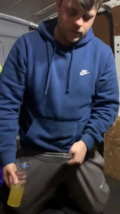 scally boy pisses in a bottle