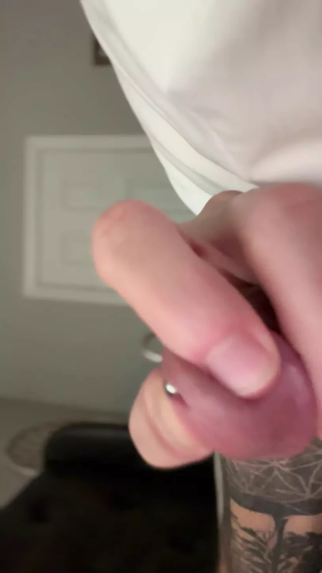 Adult starts to insert piercing into hole and pre
