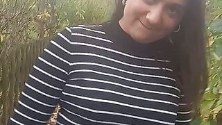 A brunette near the campsite fucks her pussy hard