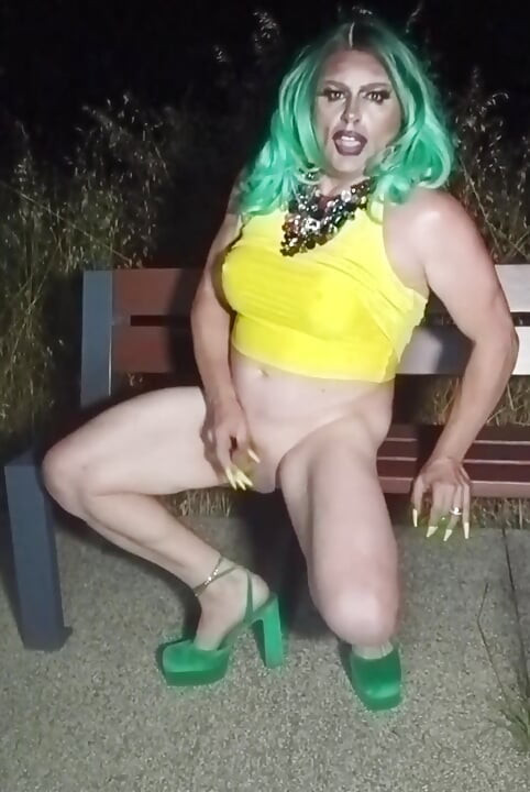 Sexy mature transvestite slut party summer showing off in a public park