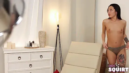 Pretty brunette squirts and screams from pleasure