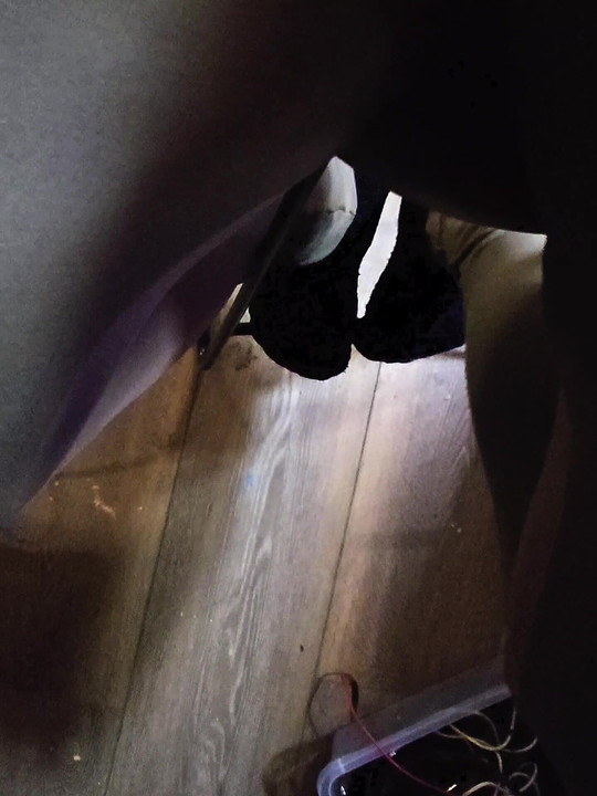 Sitting on wooden stool peeing down my legs and into my tights