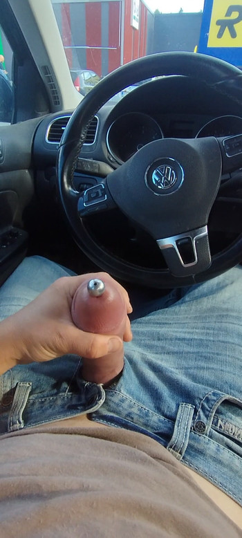 Wanking pumped cock with penis plug  in public parking