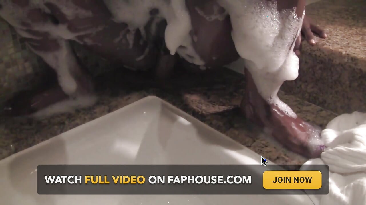 Ebony relaxes in bathtub