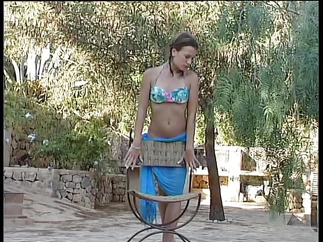 Brunette teen with small tits showing her body outdoors