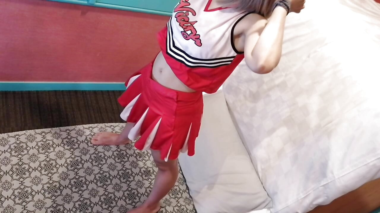 A cute, busty married woman performs exercise 4 in an erotic cheerleader costume. Peeking down from above. Home made amateur Private Shoot