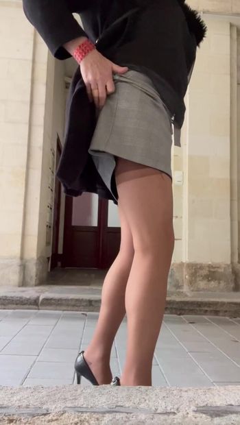 Outdoor in nylon stockings, miniskirt and high heels