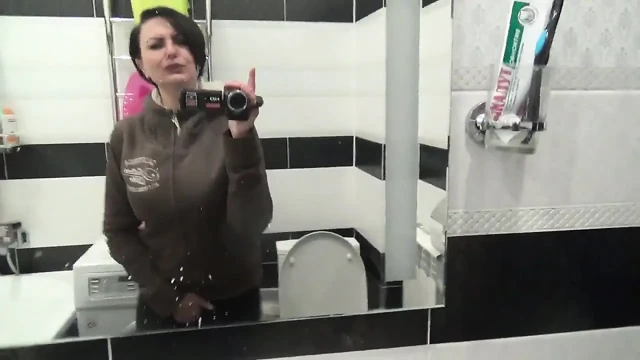 Pissing on the toilet long and a lot after long desperation and a lot of liquids