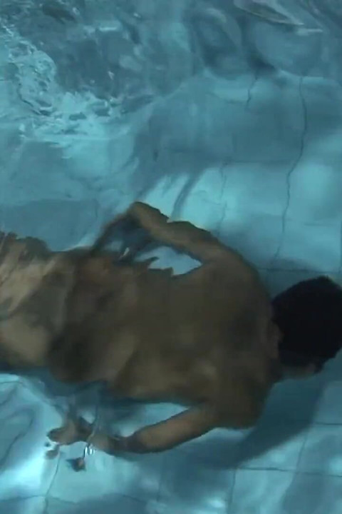 Latino dude jerking his dick nex to swimming pool