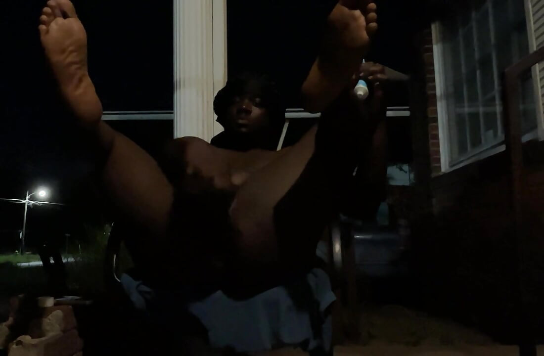 At Night Outside With The Porch Light On While Cars Passing By While I’m Playing Around On The Porch