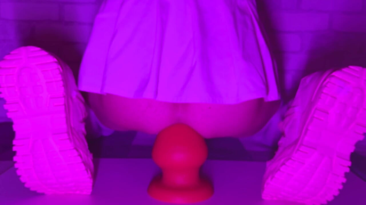 Sissy Girl In Short Skirt Bounces On a Huge 12-centimeter Thick Anal Plug