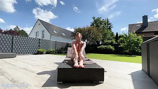 Hot milf pampers her sexy body on the terrace and oils herself