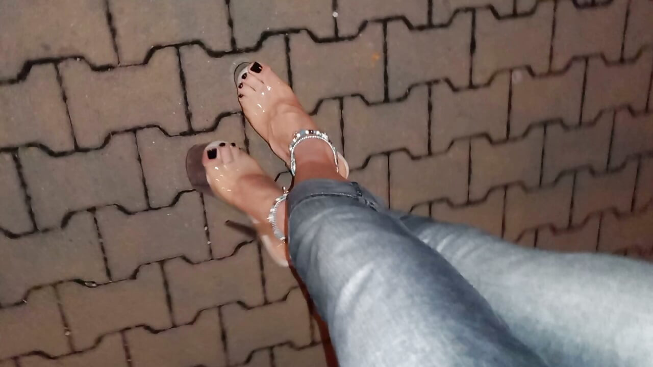 nighttime crossdressing on a public street in 20cm stripper heels, black toes, and black claws