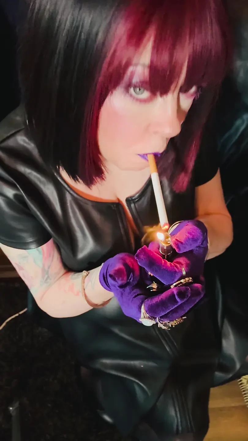 Queen Of Smoking Tina Snua Smoking A Cork Cigarette In Leather & Gloves