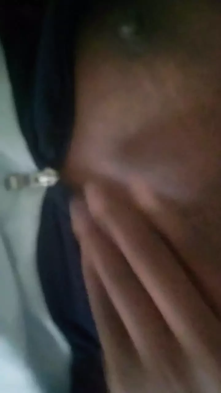 Rubbing her tits